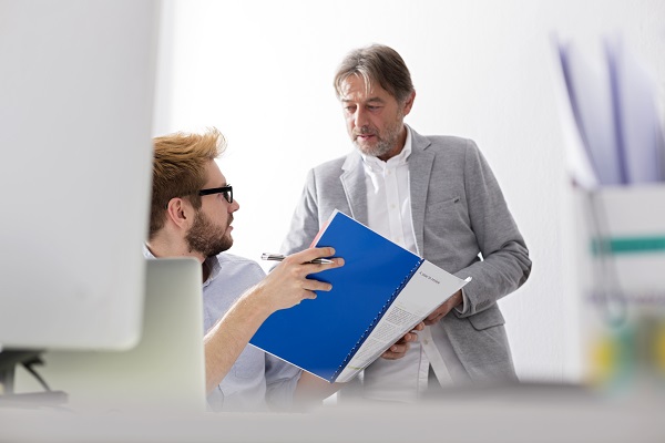 Two businessmen talking in office